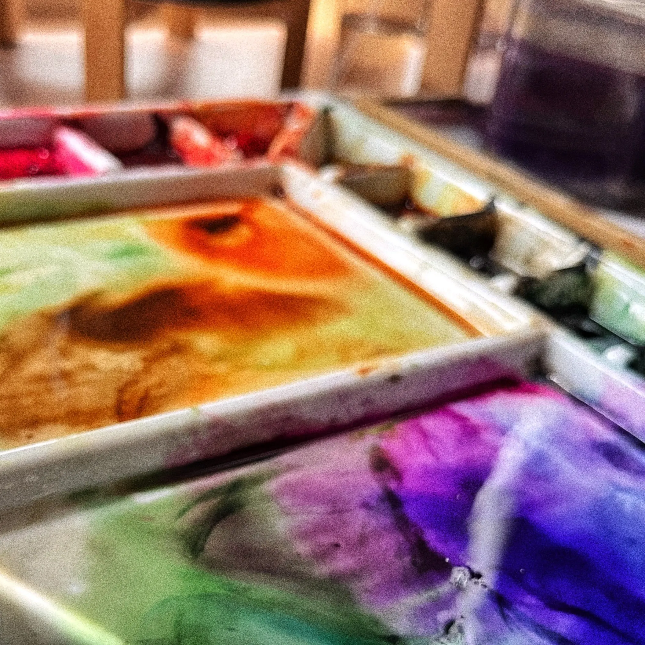 Craft supplies and painting tools on a desk